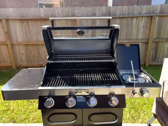 Monument Grills 42538B 4-Burner Propane Gas Grill in Black with ClearView Lid, LED Controls, Side Burner and USB Light Monument Grills 42538B 4-Burner Propane Gas Grill in Black with ClearView Lid, LED Controls, Side Burner and USB Light