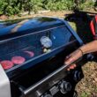 Monument Grills 42538B 4-Burner Propane Gas Grill in Black with ClearView Lid, LED Controls, Side Burner and USB Light Monument Grills 42538B 4-Burner Propane Gas Grill in Black with ClearView Lid, LED Controls, Side Burner and USB Light