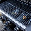 Monument Grills 42538B 4-Burner Propane Gas Grill in Black with ClearView Lid, LED Controls, Side Burner and USB Light Monument Grills 42538B 4-Burner Propane Gas Grill in Black with ClearView Lid, LED Controls, Side Burner and USB Light