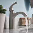 Moen Lindor Transitional Spot Resist Brushed Nickel Single Hole 1-handle WaterSense High-arc Bathroom Sink Faucet with Drain and Deck Plate