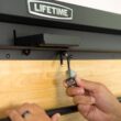 Lifetime 80421 47 in. L x 31 in. D x 60.5 - 71.5 in. H Wall-Mounted Folding Work Table