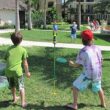 Bottle Bash Outdoor Flying Disc Game Set – Disc Toss Game for Family, Frisbee Target Lawn Game with Poles & Bottles