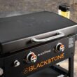 Blackstone 1883 Original 28” Griddle with Integrated Protective Hood and Counter Height Side Shelves, Powder Coated Steel, Black Blackstone 1883 Original 28” Griddle with Integrated Protective Hood and Counter Height Side Shelves, Powder Coated Steel, Black