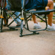 Close-up of the Freestyle Rocker legs with labeled shock absorbers and can holder in use.