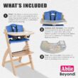 Abiie Beyond Junior Wooden High Chair with Tray - Adjustable and Convertible High Chair for Babies and Toddlers - 6 Months to 250 Lb - Water Resistant - Natural Wood with Blueberry Cushion