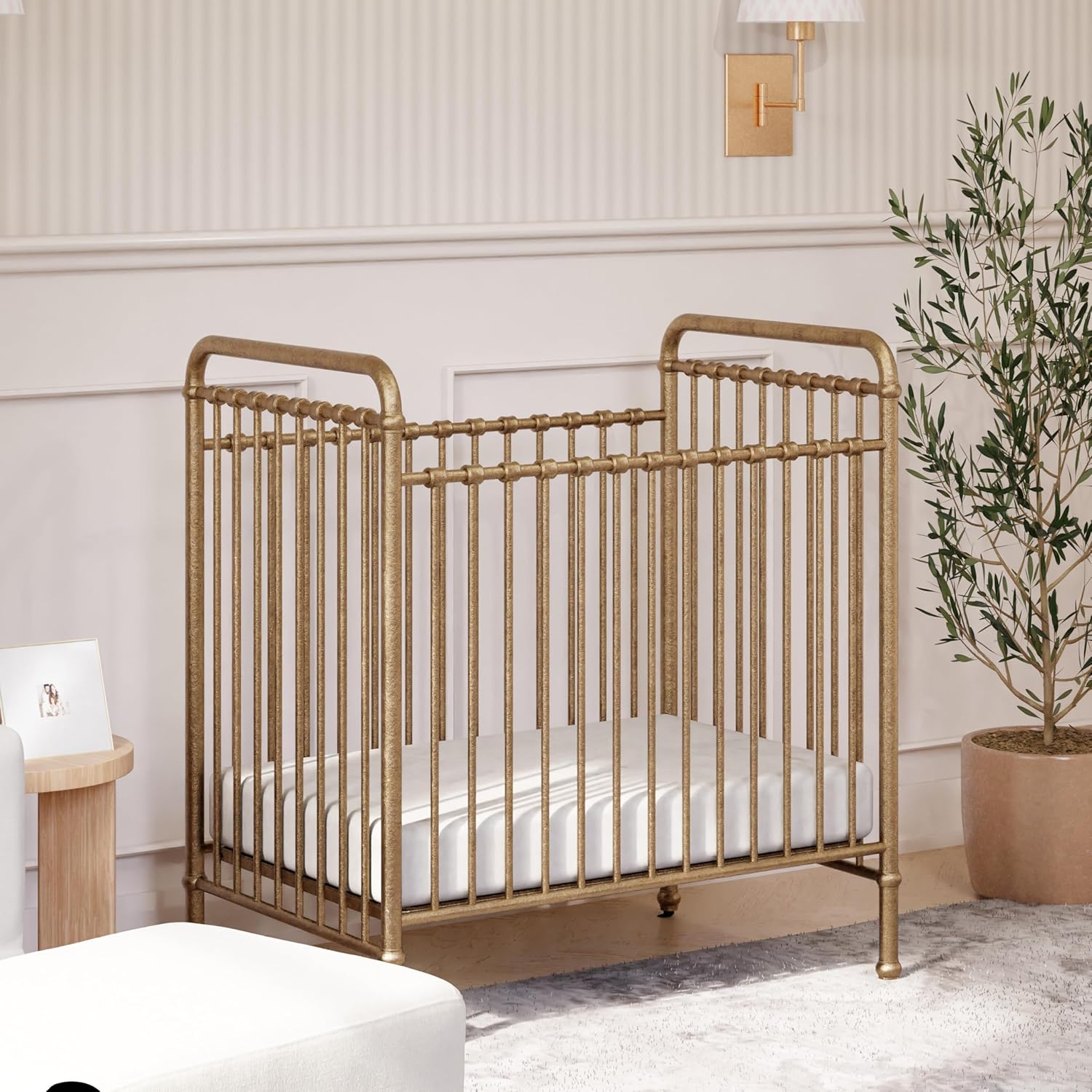 NAMESAKE Abigail 3-in-1 Portable Baby Crib with Wheels - Metal Baby Bed w/ 4 Adjustable Mattress Heights, for Small Spaces - Gold NAMESAKE Abigail 3-in-1 Portable Baby Crib with Wheels - GREENGUARD Gold Certified Convertible Crib to Toddler Bed & Daybed - Metal Baby Bed w/ 4 Adjustable Mattress Heights, for Small Spaces - Gold