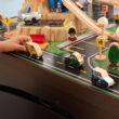 KidKraft Metropolis Wooden Train Set and Train Table with 100 Accessories