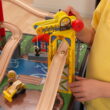 KidKraft Metropolis Wooden Train Set and Train Table with 100 Accessories