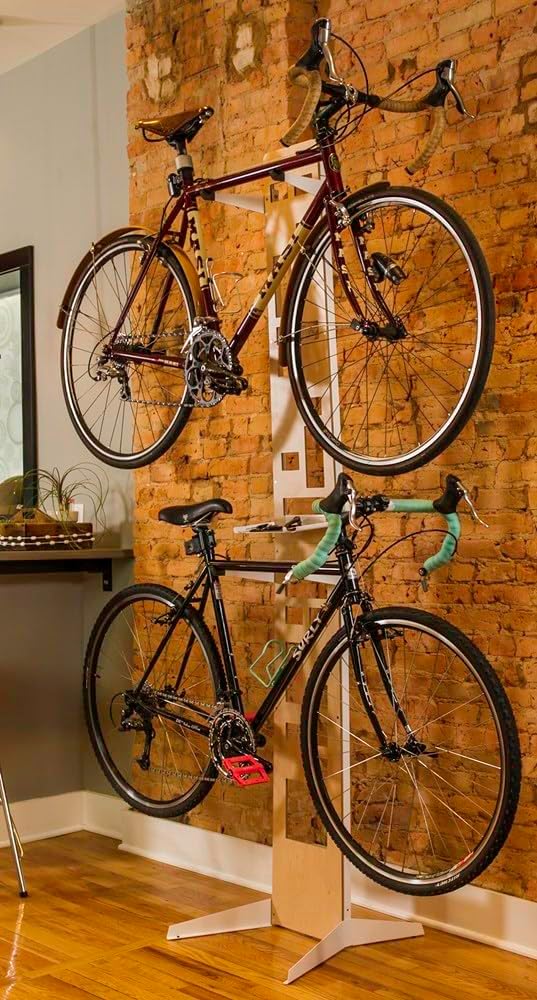 Saris The Hottie Two Bike Home Storage Stand – Freestanding, Stylish Bike Rack – Holds 2 Bikes up to 35 lbs Each Saris The Hottie Two Bike Home Storage Stand – Freestanding, Stylish Bike Rack – Holds 2 Bikes up to 35 lbs Each – Adjustable Cradles – Built-in Accessories Shelf – No Drilling or Mounting Required