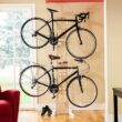 Saris The Hottie Two Bike Home Storage Stand – Freestanding, Stylish Bike Rack – Holds 2 Bikes up to 35 lbs Each Saris The Hottie Two Bike Home Storage Stand – Freestanding, Stylish Bike Rack – Holds 2 Bikes up to 35 lbs Each – Adjustable Cradles – Built-in Accessories Shelf – No Drilling or Mounting Required