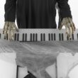 Haunted Living 6-ft Skeleton Reaper Keyboard Player Motion Activated Animatronic Haunted Living 6-ft Skeleton Reaper Keyboard Player Motion Activated Animatronic