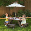 KidKraft Wooden Octagon Table, Stools & Umbrella Set, Kids’ Outdoor Furniture, Brown Bear & Beige