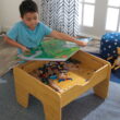 KidKraft Reversible Wooden Activity Table with Board and Train Set, Natural, for Ages 3+ Years