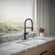 KOHLER Koi Pre-Rinse Spring Matte Black Single Handle Deck-mount Pull-down Kitchen Faucet with Sprayer (Includes Deck Plate) (Includes Soap Dispenser)