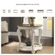 Signature Design by Ashley Realyn Oval Coffee Table with White Frame and Brown Distressed Wood Top