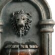 Teamson Home 32.1 in. Wall-Mounted Lion Head Stone LED Outdoor Water Fountain for Gardens, Landscaping, Patios, Balconies, Lawns to Create a Calming Oasis in Outdoor Living Spaces, Antique Bronze