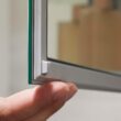 KOHLER Embark 35-in x 26-in Surface/Recessed Mount Anodized Aluminum Mirrored Rectangle Soft Close Medicine Cabinet